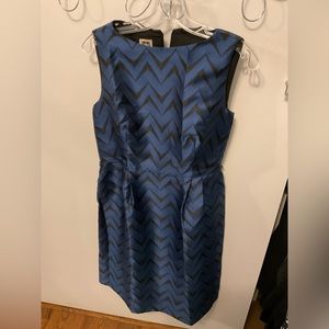 Anne Klein Knee length sheath dress with belt.